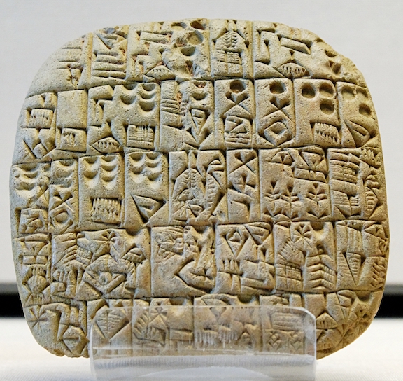 A Sumerian tablet from the Louvre, showing a sales contract for a house and field.  Public domain, via Wikimedia Commons.